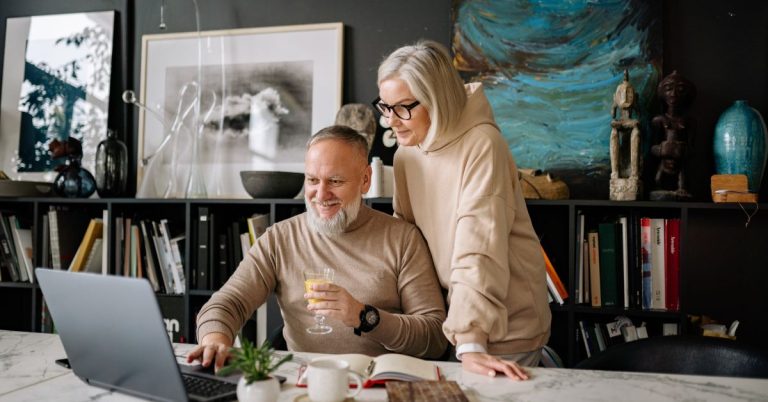 Couple reviewing their personal budget planner together at home