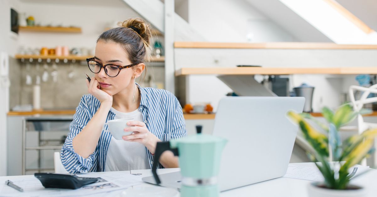 Woman reviewing budget and managing personal finances at home