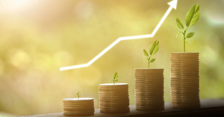 Roth IRA compound interest growth illustration showing coins and plants growing over time